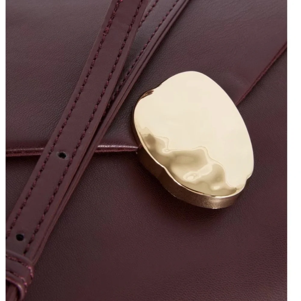 Elegant Burgundy Clutch with Gold Accent - Picture 3 of 5